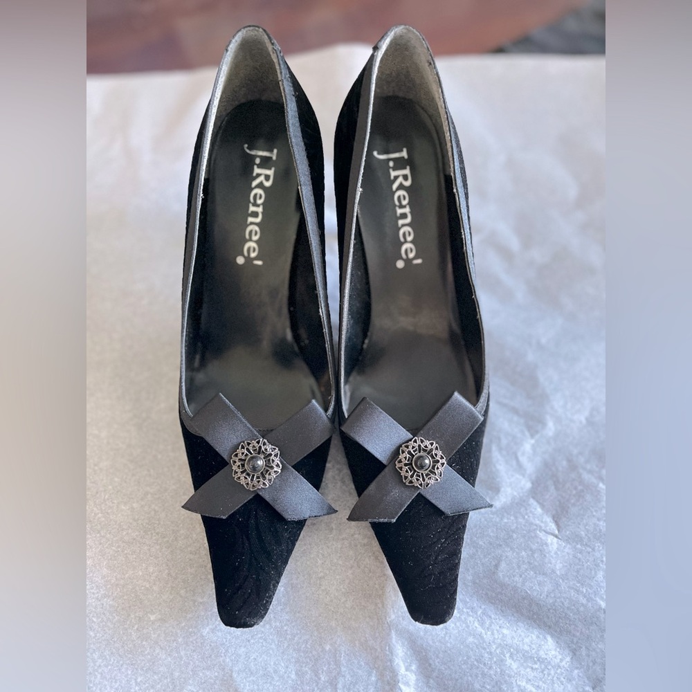 Black velvet kitten heels.